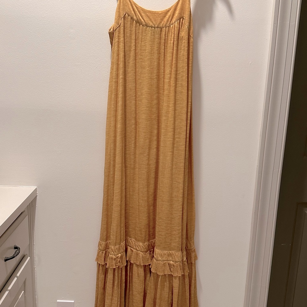Maxi sundress in burnt gold color. Great loose but becoming fit. Size S